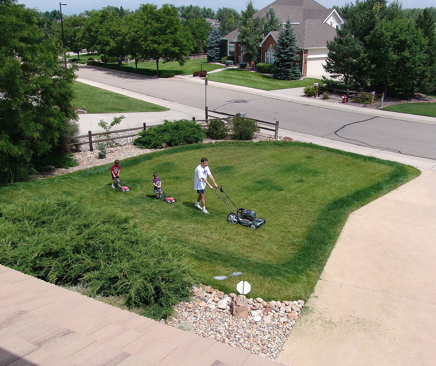 boys mowing lawn