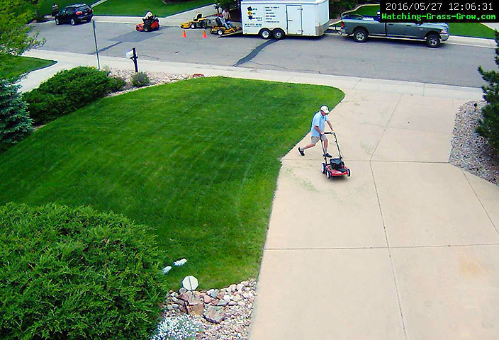 mowing grass with commercial lawn service
